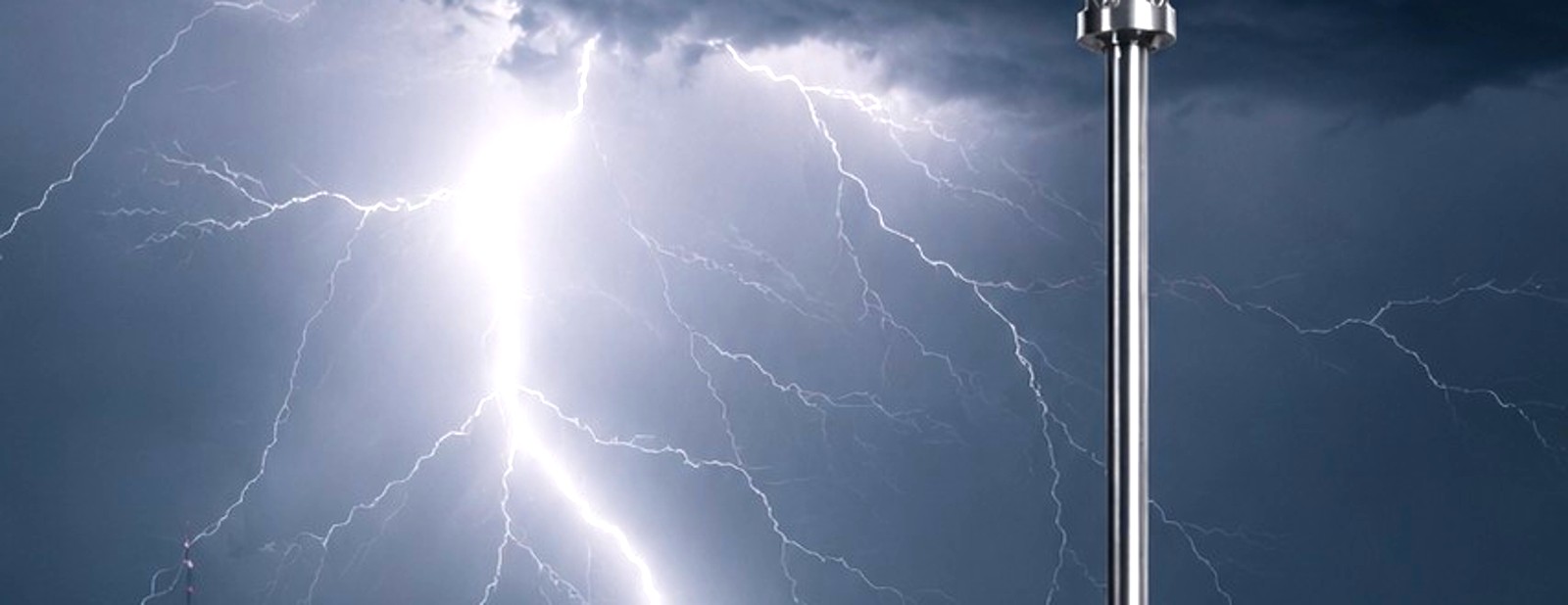 Lightning striking above a commercial installation